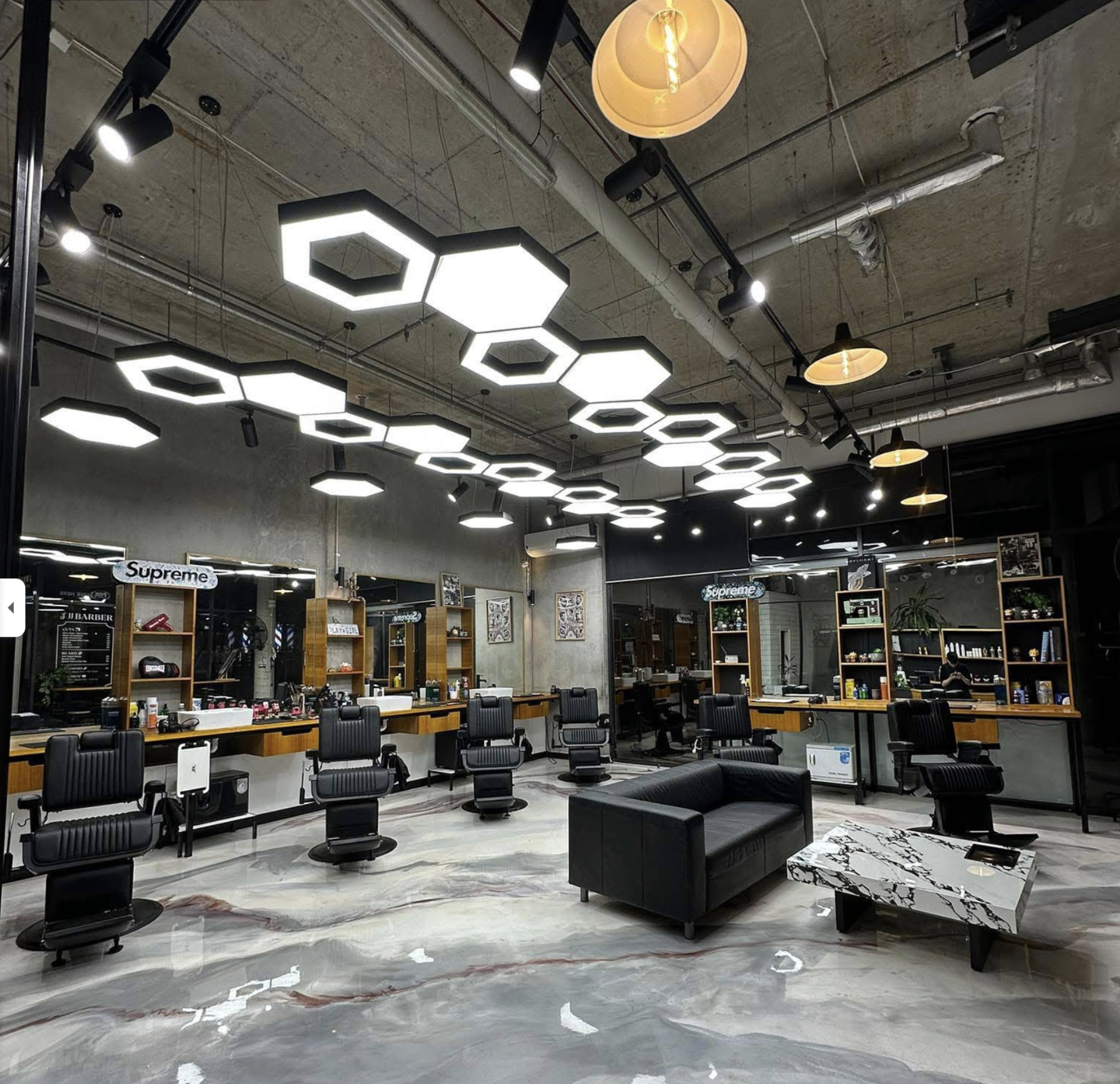 Modern JJJ Barber interior with barber chairs